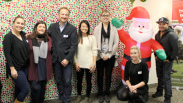 Trafalgar team celebrates the season with Holiday Helpers wrap-a-thon