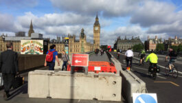 Pedestrians walk past newly erected barriers separating the road from the pavement on Westminster Bridge following an attack which left 7 people dead and dozens of injured in central London, Britain, June 5, 2017. REUTERS/Estelle Shirbon