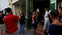 Tourists take pictures in Havana, Cuba